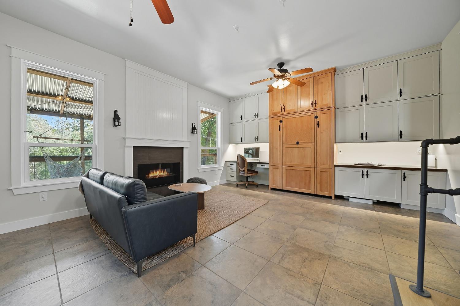 2988 Spring Hill Road San Andreas, CA 95249 - Photo 26 of 95 a living room with furniture a fireplace and a window