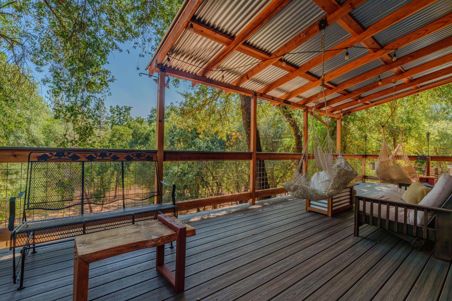 2988 Spring Hill Road San Andreas, CA 95249 - Photo 9 of 95 a view of a balcony with wooden floor next to a yard