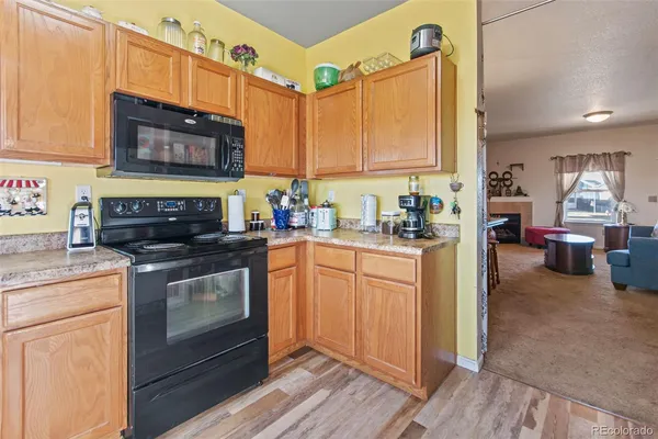 a kitchen with stainless steel appliances a stove a sink and a microwave