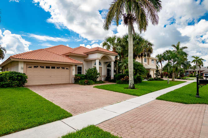 a front view of a house with garden