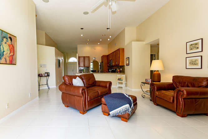 19627 Dinner Key Drive Boca Raton, FL 33498 - Photo 14 of 46 a living room with furniture and a lamp