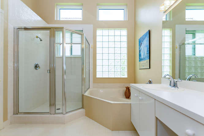 19627 Dinner Key Drive Boca Raton, FL 33498 - Photo 18 of 46 a bathroom with a bathtub and a sink