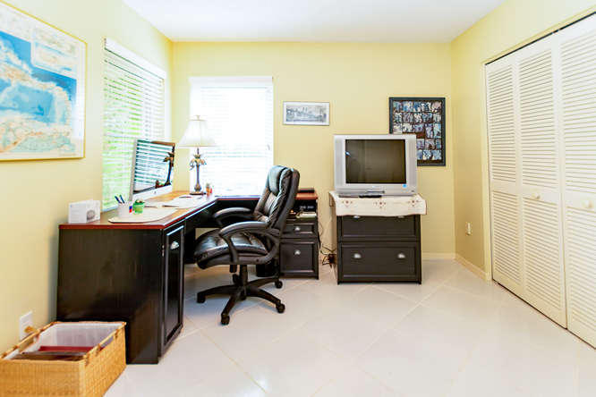 19627 Dinner Key Drive Boca Raton, FL 33498 - Photo 21 of 46 a view of a workspace with furniture and a window