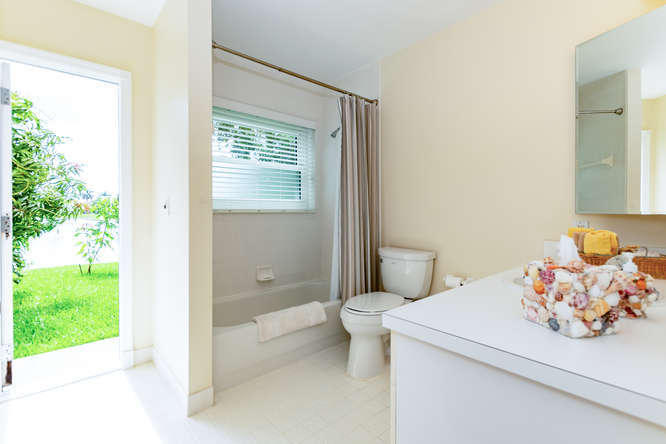 19627 Dinner Key Drive Boca Raton, FL 33498 - Photo 22 of 46 a bathroom with a sink toilet and shower
