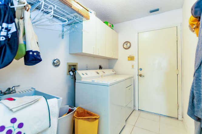 19627 Dinner Key Drive Boca Raton, FL 33498 - Photo 24 of 46 a utility room with a window dryer and washer