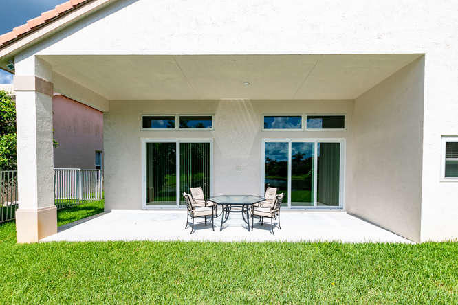19627 Dinner Key Drive Boca Raton, FL 33498 - Photo 26 of 46 a house view with a sitting space and garden