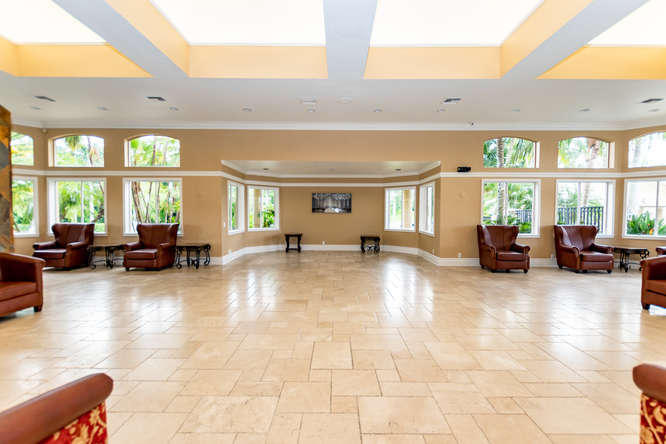 19627 Dinner Key Drive Boca Raton, FL 33498 - Photo 35 of 46 a living room with furniture and a large window