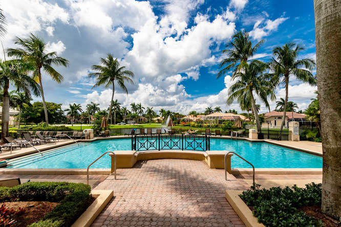 19627 Dinner Key Drive Boca Raton, FL 33498 - Photo 38 of 46 a view of a swimming pool with a patio
