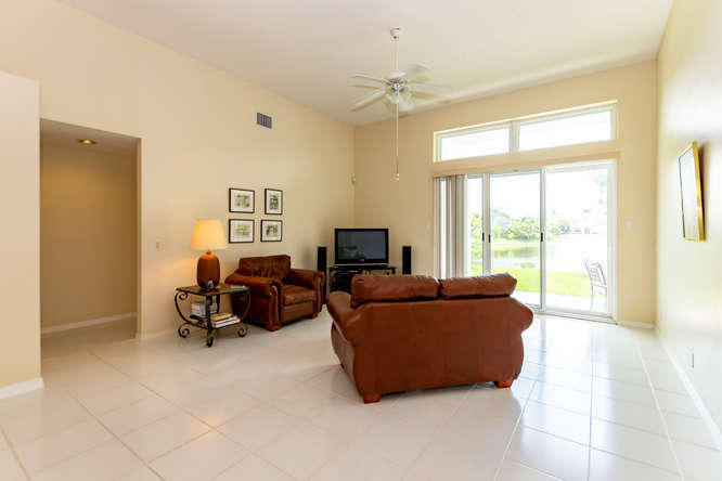 19627 Dinner Key Drive Boca Raton, FL 33498 - Photo 4 of 46 a living room with furniture and a flat screen tv