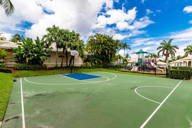 19627 Dinner Key Drive Boca Raton, FL 33498 - Photo 45 of 46 a view of a playground with basketball court