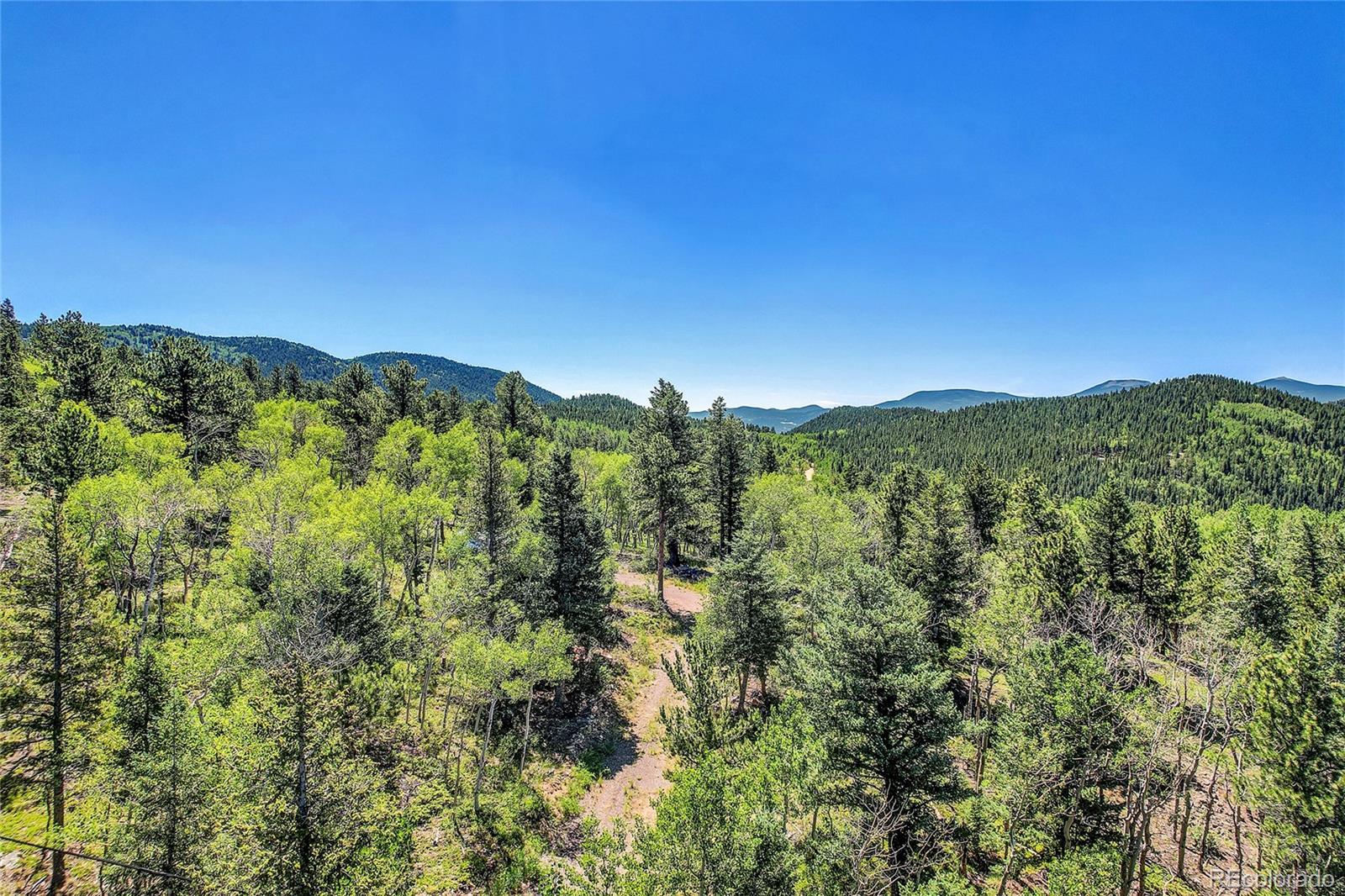 5 Hughesville Road Black Hawk, CO 80422 - Photo 13 of 17 a view of a city with lush green forest