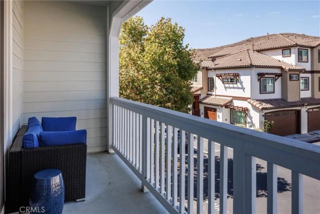 a view of a brick house with a balcony