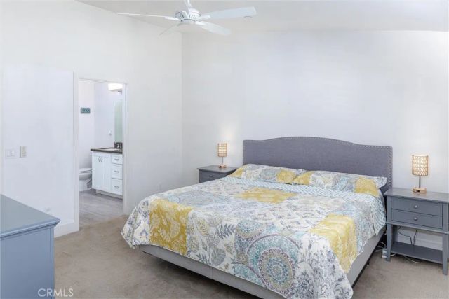 a bedroom with a bed and a cabinets