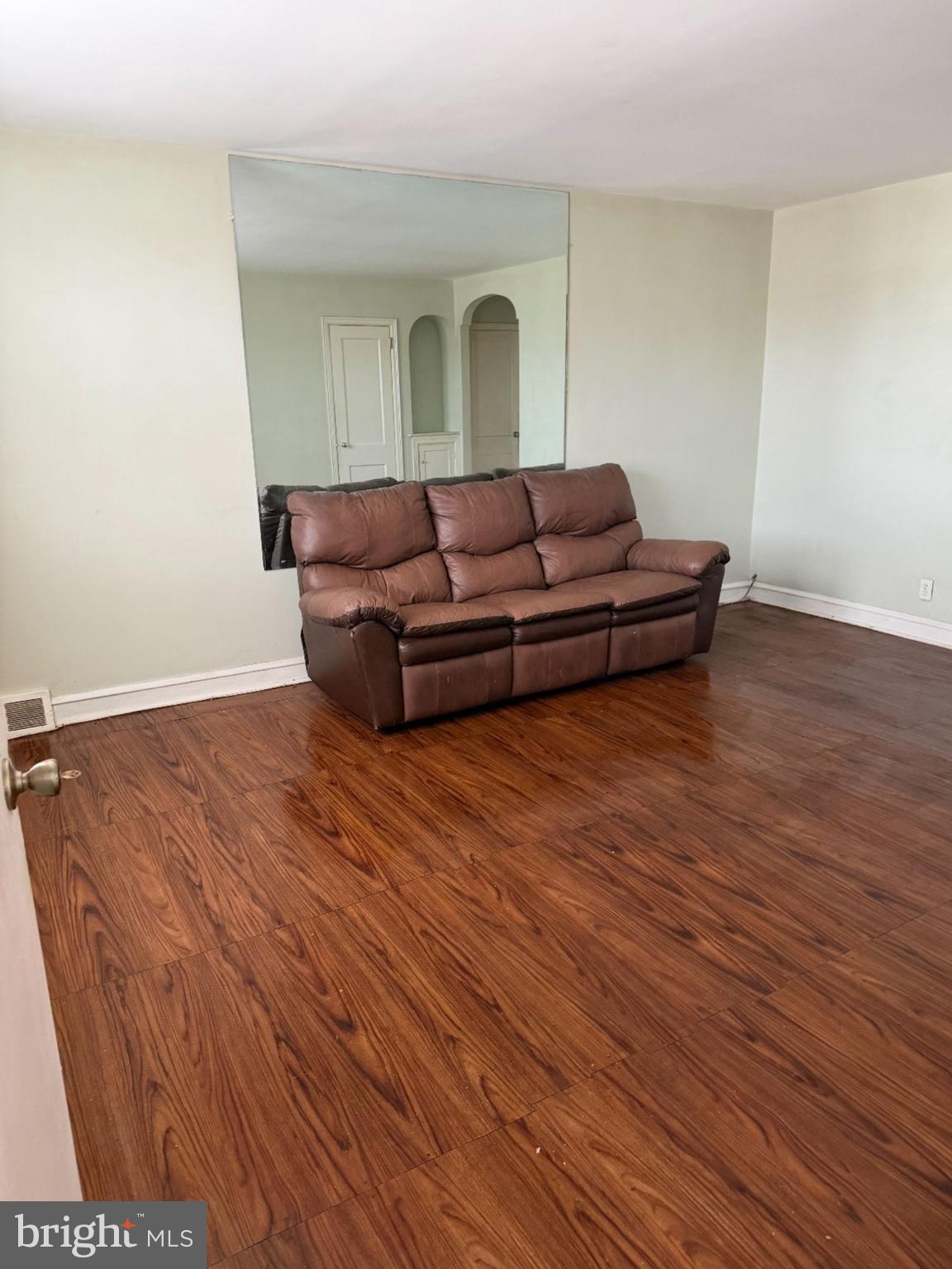 7215 Erdrick Street Philadelphia, PA 19135 - Photo 9 of 12 a living room with furniture and a wooden floor