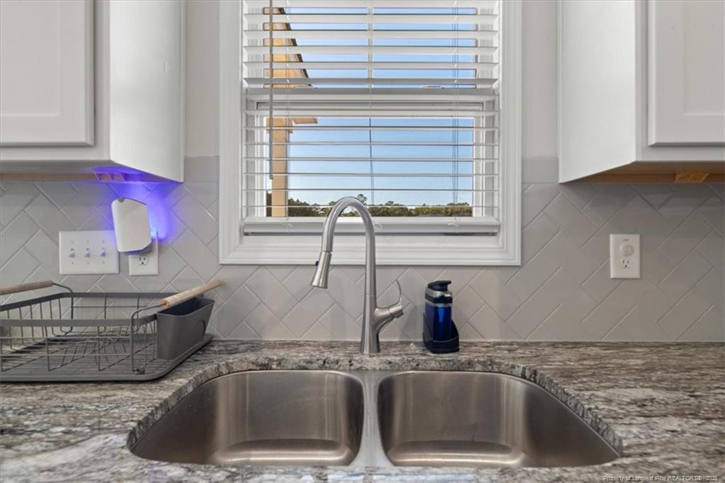 7840 Rufus Johnson Road Fayetteville, NC 28306 - Photo 25 of 50 a kitchen with a sink and a window