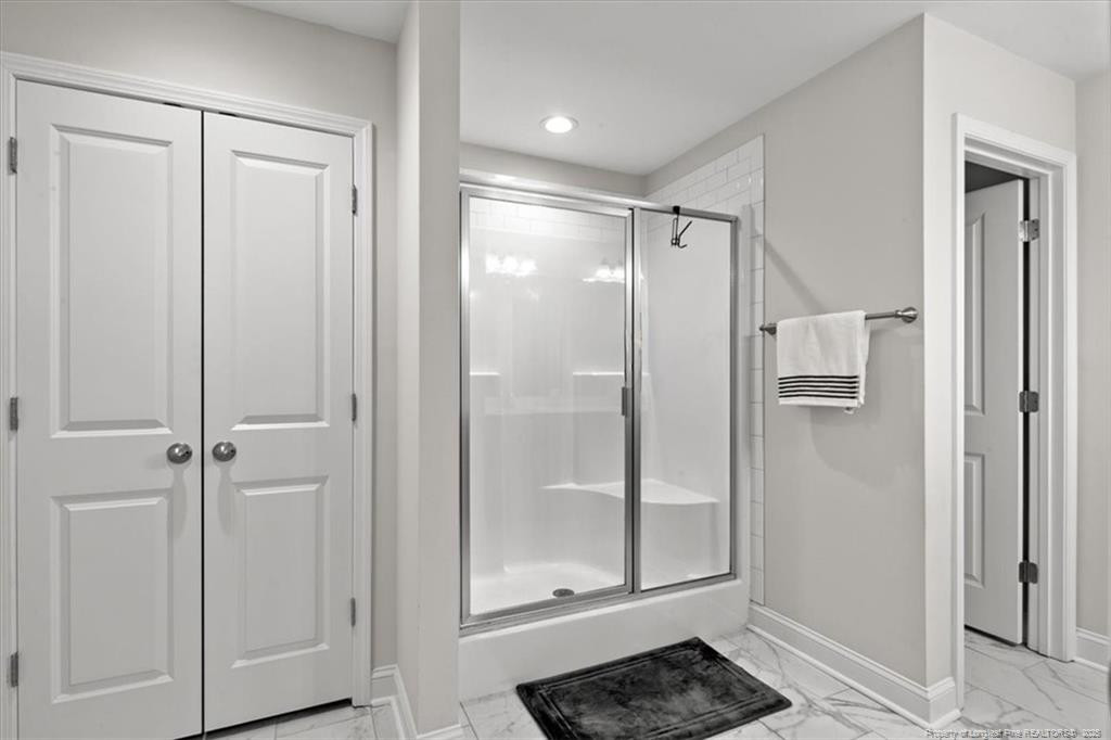 7840 Rufus Johnson Road Fayetteville, NC 28306 - Photo 44 of 50 a bathroom with a shower and toilet