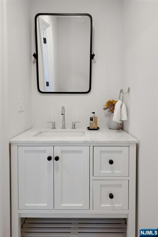 30 Edgecliff Road Montclair, NJ 07043 - Photo 20 of 46 a bathroom with a sink vanity and mirror