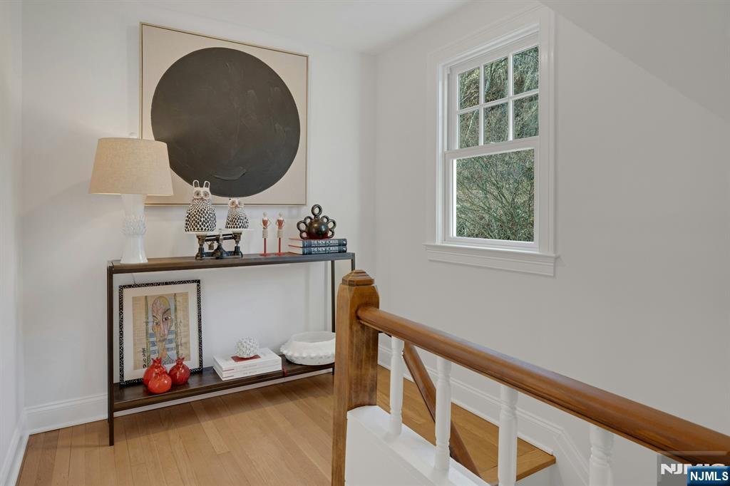30 Edgecliff Road Montclair, NJ 07043 - Photo 21 of 46 an entryway with wooden floor and mirror