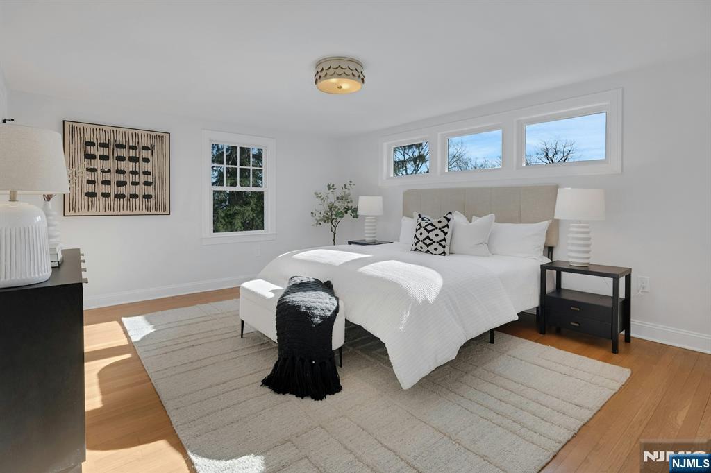 30 Edgecliff Road Montclair, NJ 07043 - Photo 22 of 46 a bedroom with a bed and a window