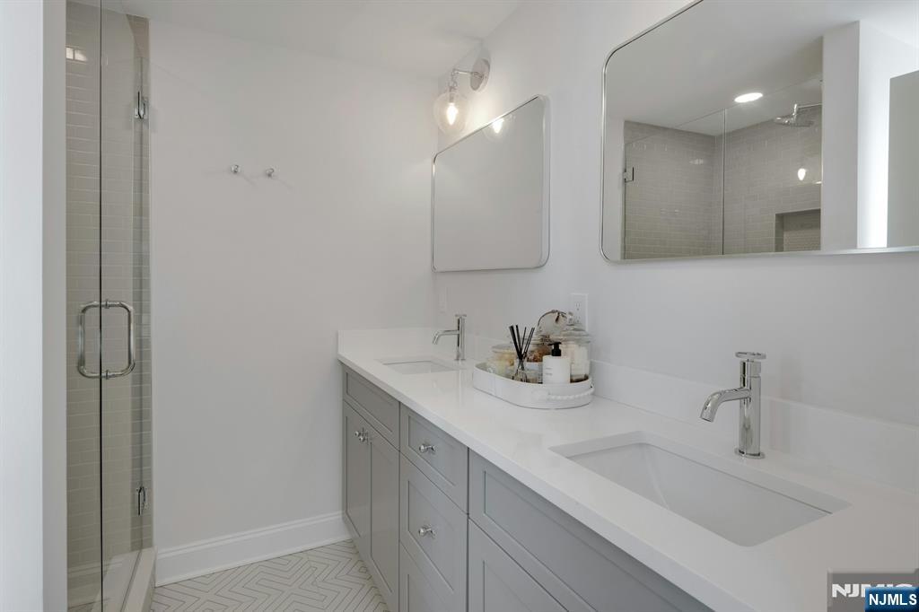 30 Edgecliff Road Montclair, NJ 07043 - Photo 24 of 46 a bathroom with a sink and a mirror