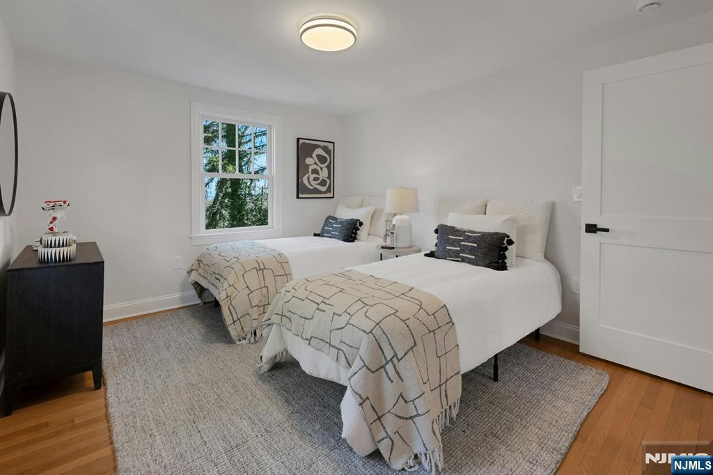 30 Edgecliff Road Montclair, NJ 07043 - Photo 26 of 46 a bedroom with double bed and a window