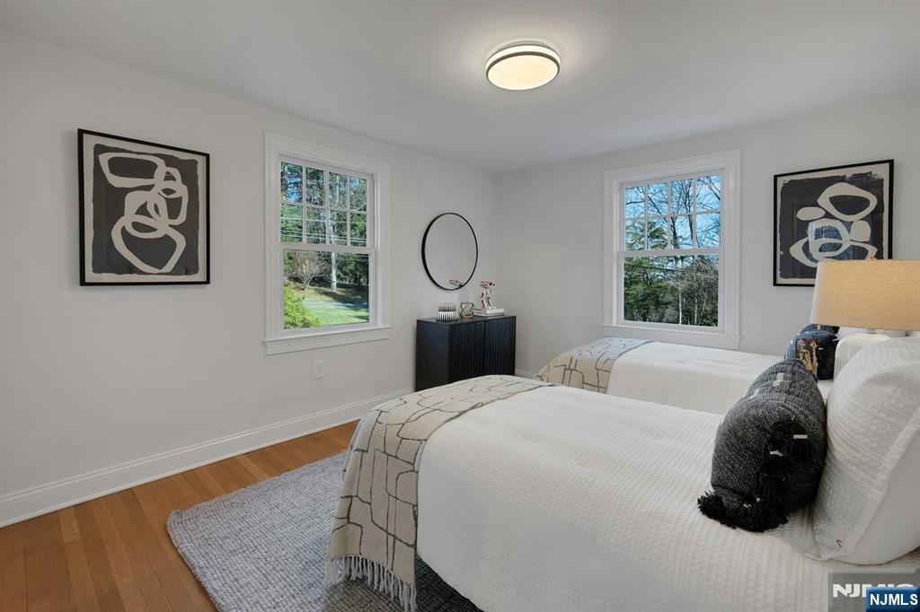 30 Edgecliff Road Montclair, NJ 07043 - Photo 27 of 46 a bedroom with a bed and a window