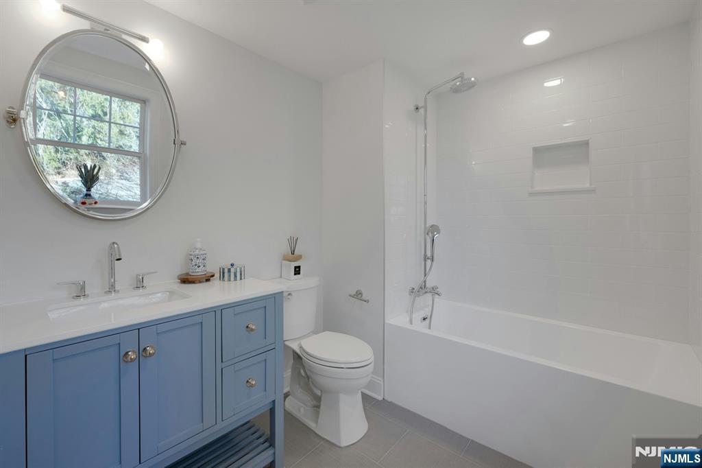 30 Edgecliff Road Montclair, NJ 07043 - Photo 28 of 46 a bathroom with a toilet a sink and bathtub