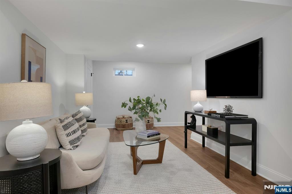 30 Edgecliff Road Montclair, NJ 07043 - Photo 32 of 46 a living room with furniture and a flat screen tv