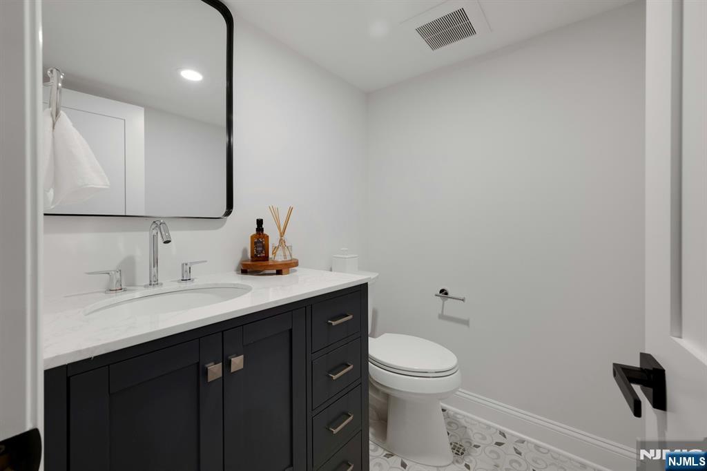 30 Edgecliff Road Montclair, NJ 07043 - Photo 35 of 46 a bathroom with a toilet sink and mirror