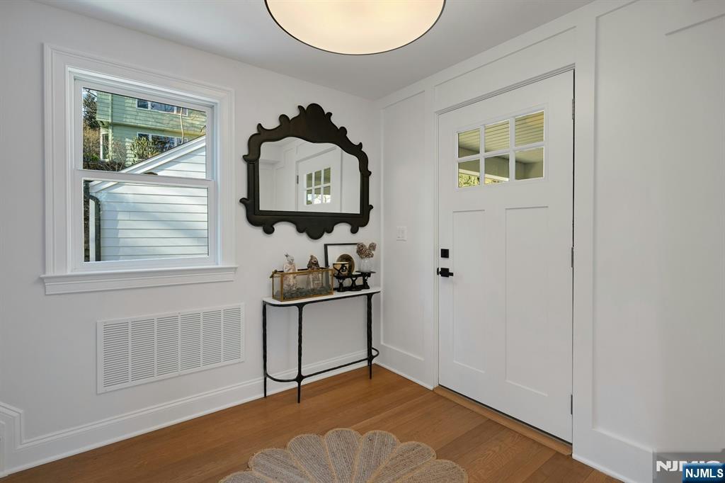 30 Edgecliff Road Montclair, NJ 07043 - Photo 4 of 46 a view of a hallway with paintings on the wall