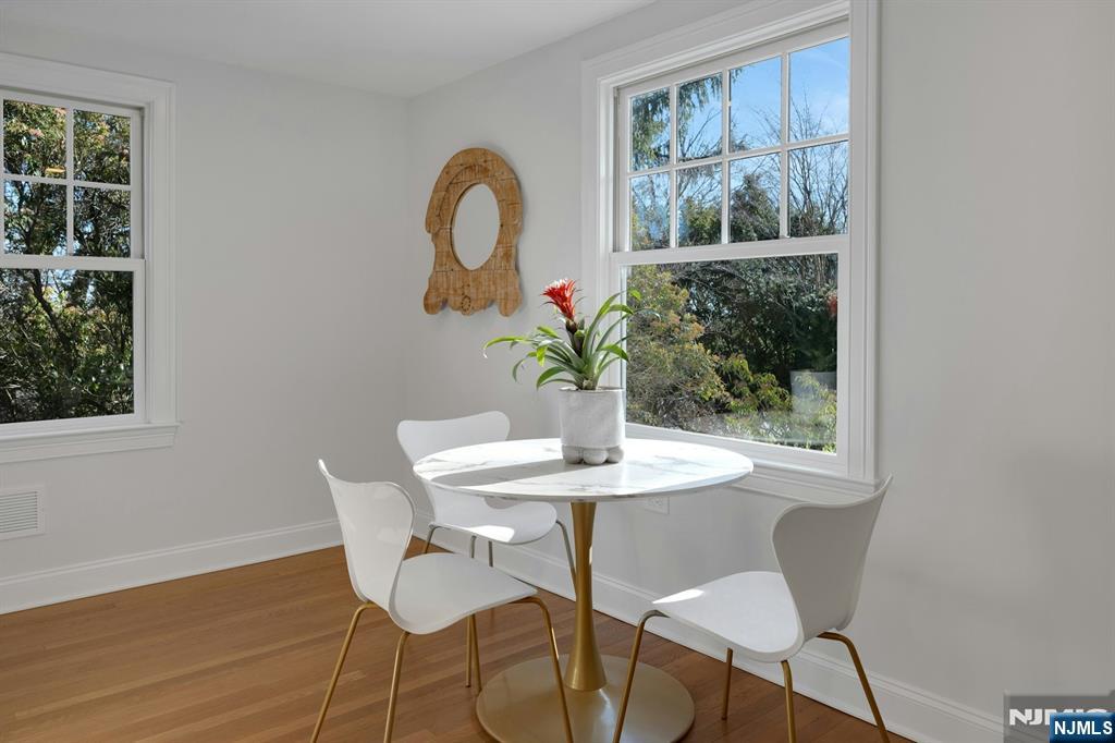 30 Edgecliff Road Montclair, NJ 07043 - Photo 10 of 46 a dining room with furniture and wooden floor