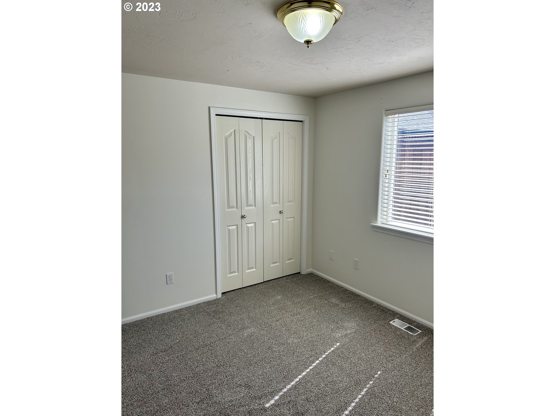 3883 Pinyon Street Springfield, OR 97478 - Photo 10 of 36 a view of an empty room with a window