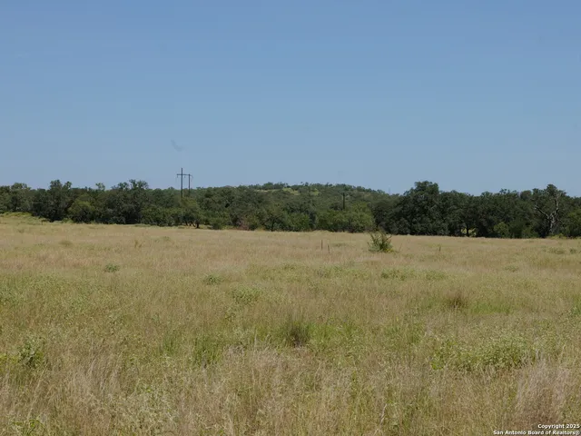 a view of swimming pool with outdoor seating and yard