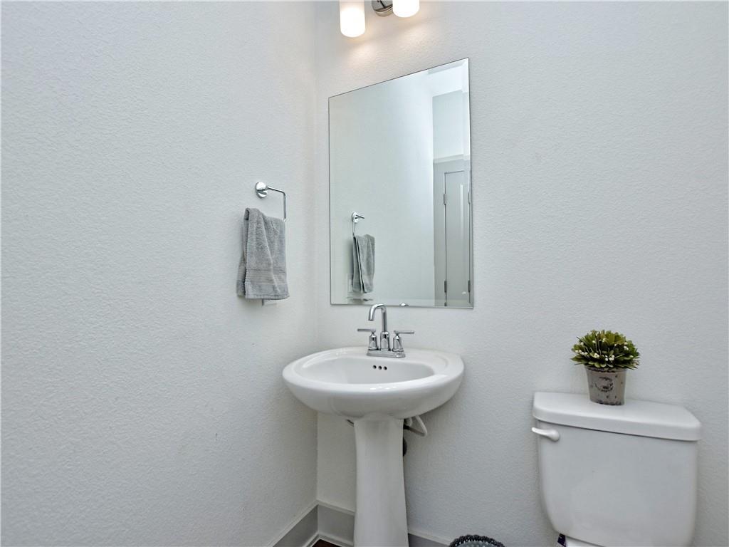 2172 Local Rebel Street Leander, TX 78641 - Photo 6 of 24 a bathroom with a sink toilet and a mirror