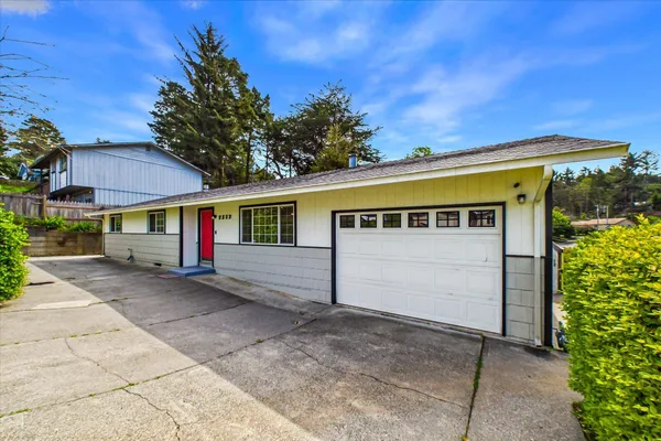 a front view of a house with a garage