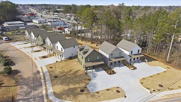 an aerial view of a house with outdoor space