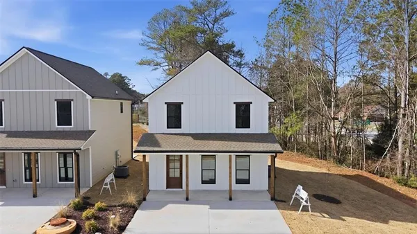 a front view of a house with garage