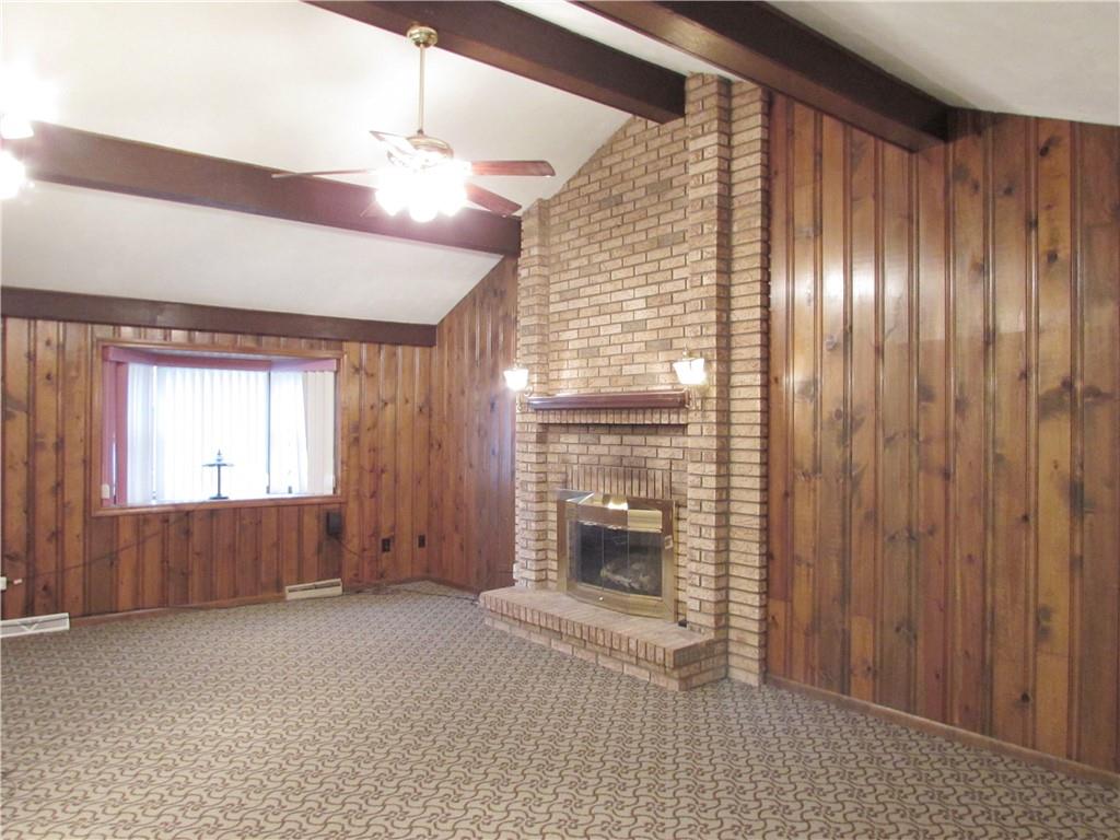 717 Blue Ridge Road Pittsburgh, PA 15239 - Photo 11 of 25 a view of empty room with floor to ceiling window and fireplace