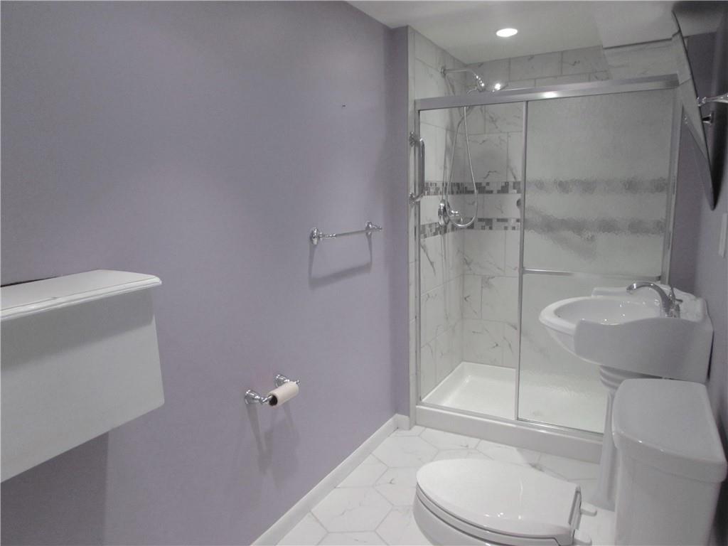 717 Blue Ridge Road Pittsburgh, PA 15239 - Photo 20 of 25 a bathroom with a toilet and a shower