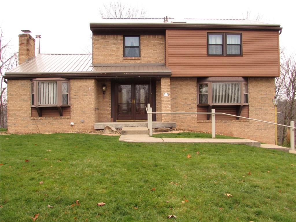 717 Blue Ridge Road Pittsburgh, PA 15239 - Photo 2 of 25 a front view of a house with a yard