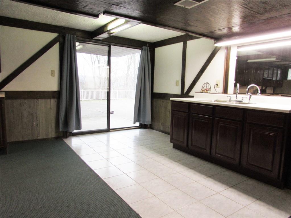 717 Blue Ridge Road Pittsburgh, PA 15239 - Photo 22 of 25 a kitchen with a sink and a large window