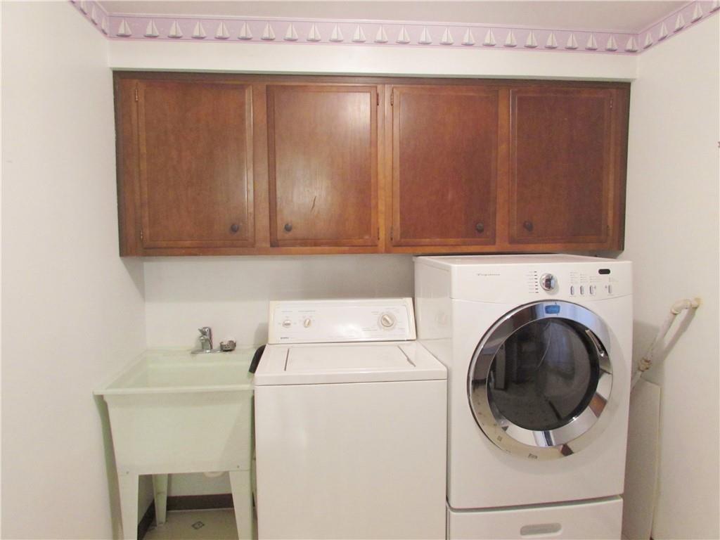 717 Blue Ridge Road Pittsburgh, PA 15239 - Photo 23 of 25 a utility room with dryer and washer