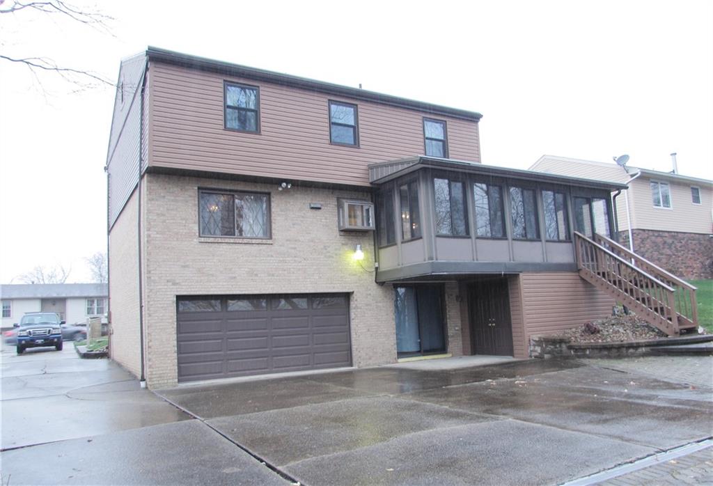717 Blue Ridge Road Pittsburgh, PA 15239 - Photo 24 of 25 a front view of a house with yard