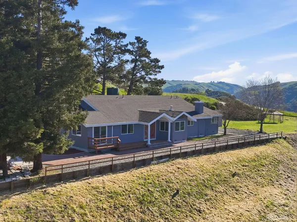 a view of a house with a garden