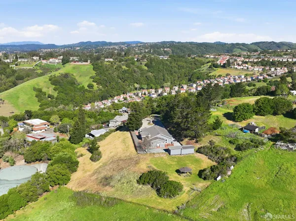 a view of a city with mountains in the background