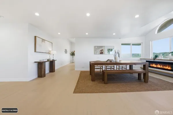 a living room with furniture a rug and a table