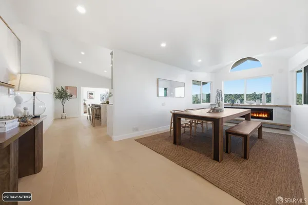 a living room with furniture a table and a potted plant