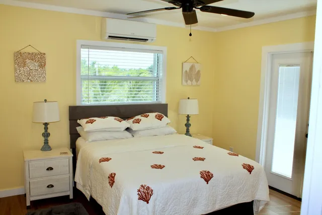 a bedroom with a bed and a window