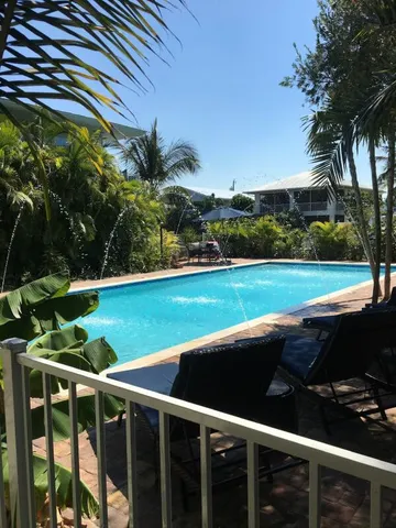 a view of a fountain in the garden