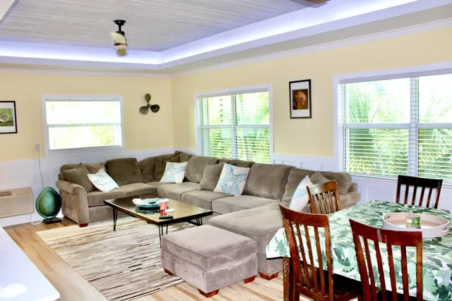 a kitchen with granite countertop a sink stainless steel appliances and window